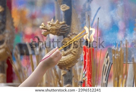 2023 June 03,Hong Kong.Citizens light incense and candles to pray for blessings from gods