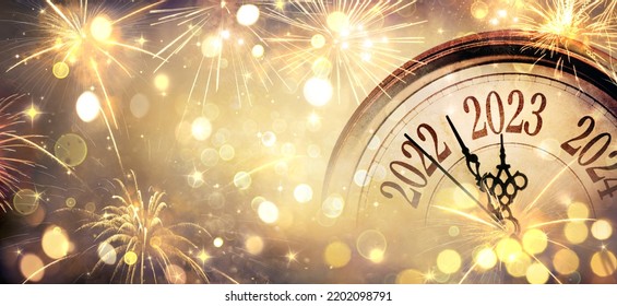 2023 New Year - Clock And Fireworks - Countdown To Midnight  - Abstract Defocused Background - Shutterstock ID 2202098791