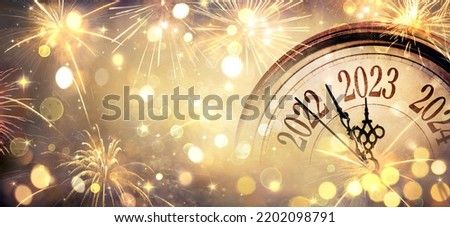 2023 New Year - Clock And Fireworks - Countdown To Midnight  - Abstract Defocused Background