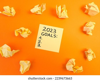 2023 new year goals list handwritten on sticky note. Motivation, self improvement, development, business background concept - Shutterstock ID 2239673663