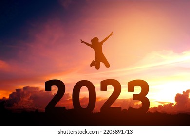 2023 Newyear Silhouette young woman jumping to Happy new year concept. - Shutterstock ID 2205891713