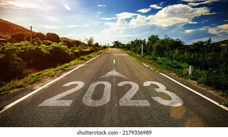 2023 written on highway road in the middle of empty asphalt road and beautiful blue sky. Concept for vision new year 2023. - Shutterstock ID 2179336989