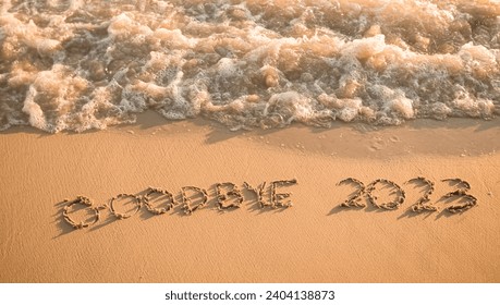 2023 year written on the beach in the sunset time. Goodbye 2023 concept