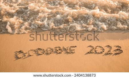 2023 year written on the beach in the sunset time. Goodbye 2023 concept