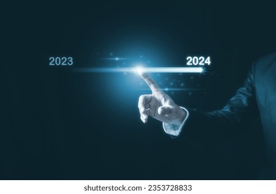 2024 business planning and strategy concept, Hand touching on download bar status to change from 2023 to 2024 for countdown of merry Christmas and happy new year by technology concept, 2024 trend