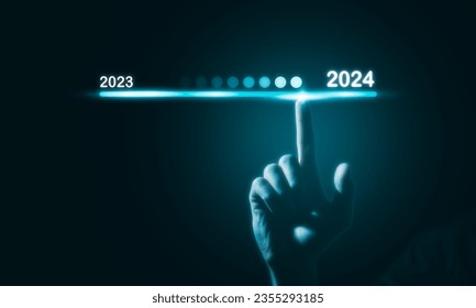 2024 business planning and strategy concept, Hand touching on download bar status to change from 2023 to 2024 for countdown of merry Christmas and happy new year by technology concept, 2024 trend - Powered by Shutterstock - Get 15% off with code: PIKWIZARD15
