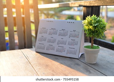 2024 Calendar desk place on the table. Desktop Calender for Planner to plan agenda, timetable, appointment, organization, management each date, month, and year on wooden office table. Calendar Concept - Powered by Shutterstock