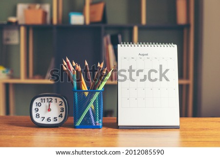 2024 Calendar desk place on table. Desktop Calender for Planner to plan agenda, timetable, appointment, organization, management each date, month, and year on wooden office table.Calendar Concept.