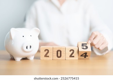 2024 end year to Happy New Year 2025 with piggy bank. Resolution, Goals, Plan, Action, Money Saving, Retirement fund, Pension, Investment and Financial concept - Powered by Shutterstock