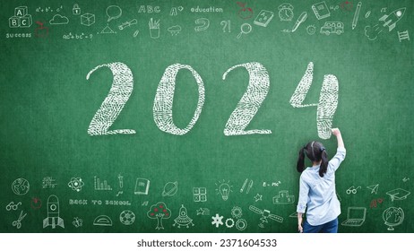 2024 Happy new year school class academic calendar with student kid's hand drawing greeting on teacher's green chalkboard for educational celebration, back to school, STEM education classroom schedule - Powered by Shutterstock