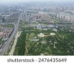 2024 Luolong District, Luoyang City, China, aerial photography of the Sui and Tang Dynasty City Ruins Botanical Garden, Wangcheng Avenue, Luoyang Museum, Luo River, and Luoyang Municipal Government Bu