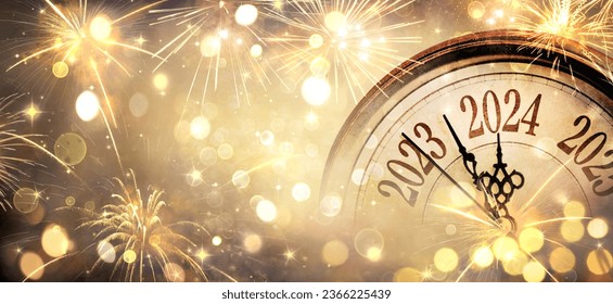 2024 New Year - Clock And Golden Fireworks - Countdown To Midnight  - Abstract Defocused Background
