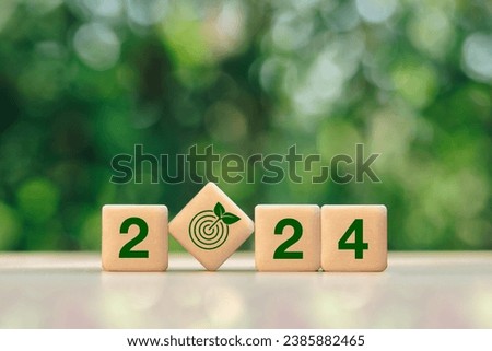 2024 New Year goal for Business plan and development for achieving goals concept.2024 and target icon on a green background.Green business and sustainability investment.