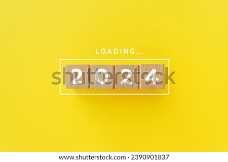 2024 New Year Loading. Loading bar with wooden blocks 2024 on yellow background. Start new year 2024 with goal concept, action plan, strategy, new year business vision