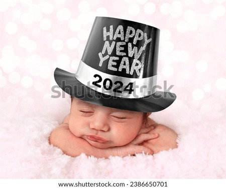 2024 Newborn baby girl wearing a Happy New Year hat. 