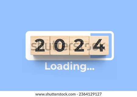 2024 wooden cubes on blue background with loading bar