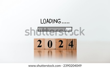 2024 year inscription on wooden blocks and loading bar by hand writing. New year starting concept