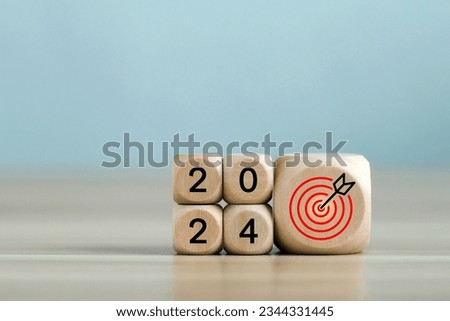 2024 year with the target which prints screens on wooden cube blocks with ideas for Business plans and goals and strategies that will lead to business success and a better life in the new year. Stock photo © 