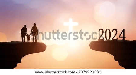 2024 year worship concept ,Silhouette people looking for the cross on autumn sunrise background
