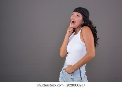 20-24 Years Old Chinese Girl With Bandana On Neutral Background, Putting Funny Expression.