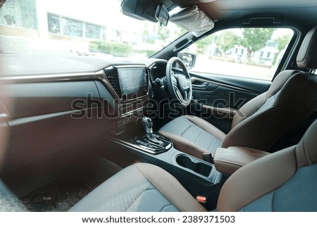 2024.Modern car interior with leather panel, multimedia and dashboard, Interior of a modern automobile showing the dashboard