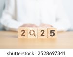 2025 block with magnifying glass icon. SEO, Search Engine Optimization, hiring , Advertising, Idea, Strategy, marketing, Keyword, Content and New Year start concepts