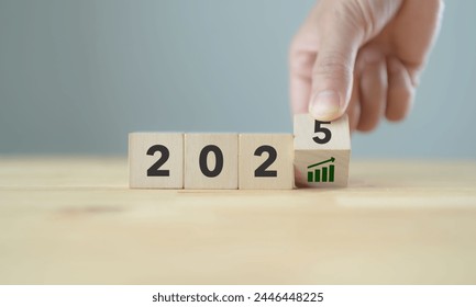 2025 business growth, acceleration concept. New year business goals, plan, strategy. Flipping wooden cubes to 2025 and growth performance. Banner for the new action plan ,annual plan, growth, target. - Powered by Shutterstock