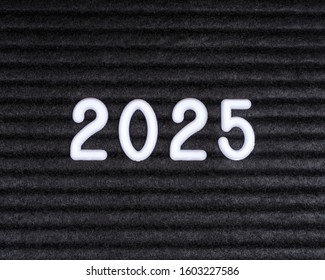 2025 message displayed on a felt letter board.