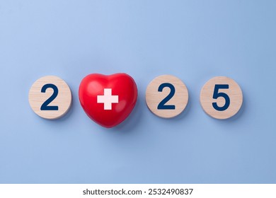 2025 New year for healthcare concept. A red heart and the numbers 2025 arranged horizontally on a light blue background. health insurance. Mental Wellness. medical. New year resolutions goal.  - Powered by Shutterstock