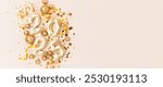 2025 New Year holidays banner with copy space. Golden numbers, stars confetti and glittering ribbons on a beige background.