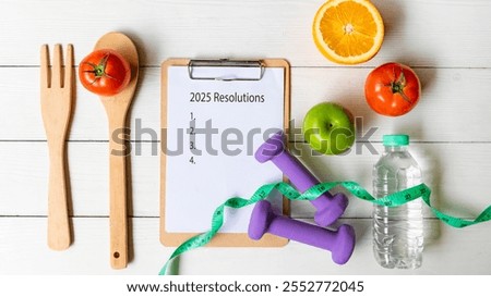 2025 Resolutions.  New year for New Changes Healthy.  Fresh vegetable fruits and healthy food for sport equipment for women diet slimming weight loss on white wood.  Healthy and Holiday Concept
