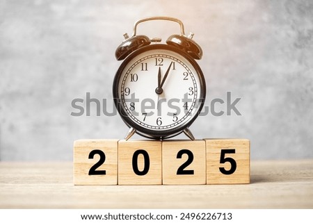 2025  text with clock on table. Resolution, time, plan, goal, motivation, reboot, countdown and New Year holiday concepts