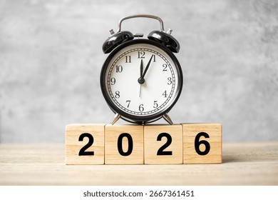 2026  text with clock on table. Resolution, time, plan, goal, motivation, reboot, countdown and New Year holiday concepts
