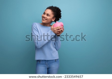 20c young afro hair brunette woman trying to count her piggy bank savings