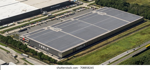 21 July 2017, Tilburg, Holland. Aerial view of Tesla Motors assembly car factory. The roof is full with solarpanels.