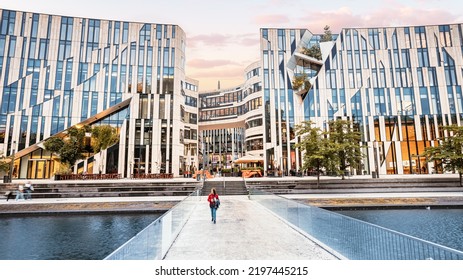 21 July 2022, Dusseldorf, Germany: Cityscape With Ko Bogen Famous Architecture Building And Water Channel With Bridge. It Is Popular Sightseeing, Business And Shopping Center.