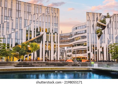 21 July 2022, Dusseldorf, Germany: Cityscape With Ko Bogen Famous Architecture Building And Water Channel. Visit Business And Shopping Center.