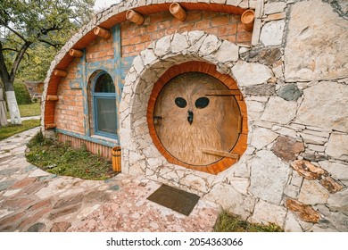 21 May 2021, Hobbit House Dilijan, Armenia: Fairytale hobbit houses with round owl door in the Shire from the movie The Lord of the Rings