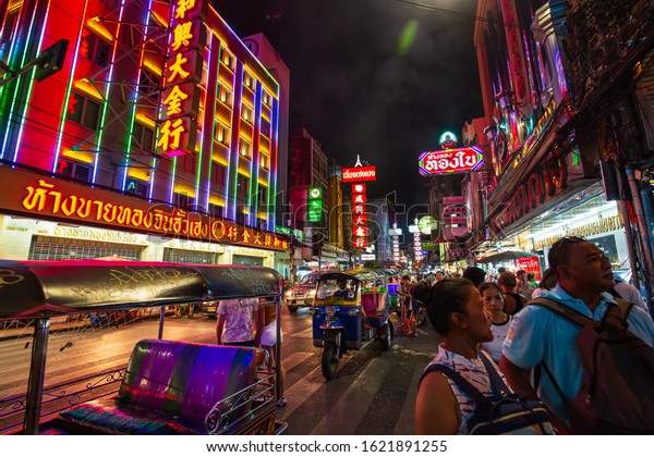 21 October,2019 Bangkok, Thailand Famous\
moto-taxi called tuk-tuk is a landmark of the city and popular\
transport, Tuk tuk on the street in Chinatown, street food night\
market in bangkok thailand.