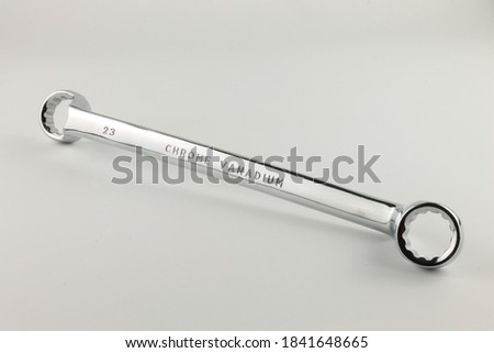 21mm and 23mm offset ring spanner made from chrome vanadium, isolated 