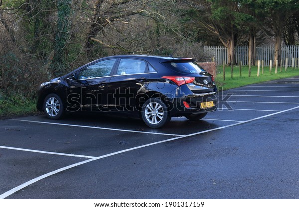 21st January 2021-  A stylish\
Hyundai i30 Style Blue Drive CRDI, five door family hatchback car,\
parked in the public carpark, at Amroth, Pembrokeshire, Wales,\
UK.