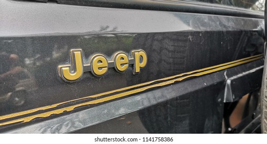 21st July 2018. A close up shot of an old Jeep cherokee's sign emblem on the side of a car body. Bangkok Thailand