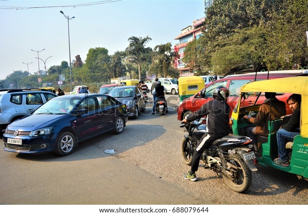 22 DECEMBER 2015 -\
DELHI, INDIA: A view of Indian traffic/ traffic jam in Delhi, India\
- Motorist, cars, auto-rickshaws, people on the road creating\
hodge-podge/chaos.