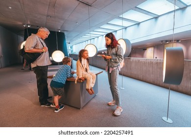 22 July 2022, Dusseldorf, Germany: Parents With Children Take A Tour Of The Neanderthal Museum Of The Ancestors Of Sapiens And Evolution. Teaching Science And Anthropology