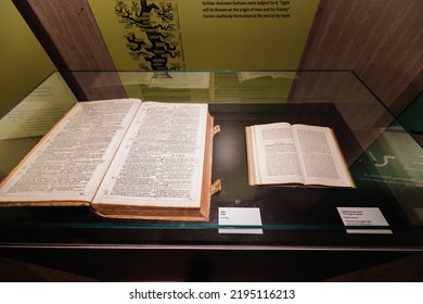 22 July 2022, Neanderthal Museum, Germany: The Open Book Of The Bible And The Origin Of Species By Charles Darwin. The Concept Of Scientific And Religious Worldview