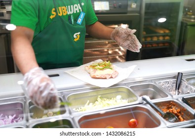 22 June 2019; Bangkok Thailand: Subway Staff is cooking Subway Sandwich at Subway Restaurant. Subway is an American fast food restaurant franchise that sells sandwiches and salads.