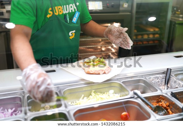 22\
June 2019; Bangkok Thailand: Subway Staff is cooking Subway\
Sandwich at Subway Restaurant. Subway is an American fast food\
restaurant franchise that sells sandwiches and\
salads.