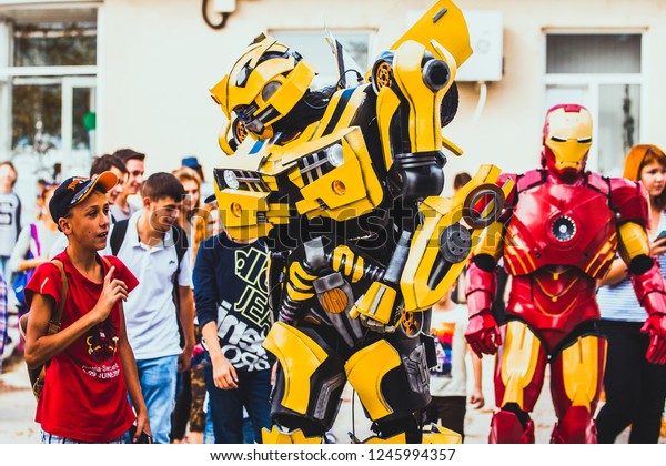 22\
september 2018 Bumblebee\'s robot from transformers and iron man,\
entertains children on an air show, Chisinau,\
Moldova