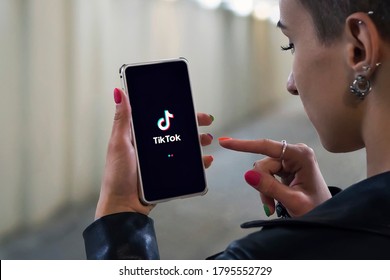 22.07.2018. Barnaul. Russia. Women holding Phone with TikTok logo on the screen. Tik Tok is Chinese app to create and share videos