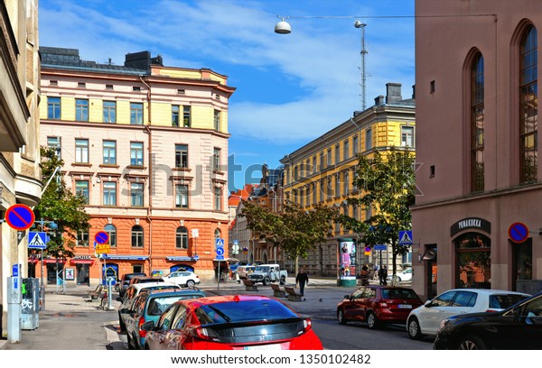 22.08.2016.street\
with cars, people, colorful old buildings and architecture and\
cloudy blue sky in Helsinki,\
Finland